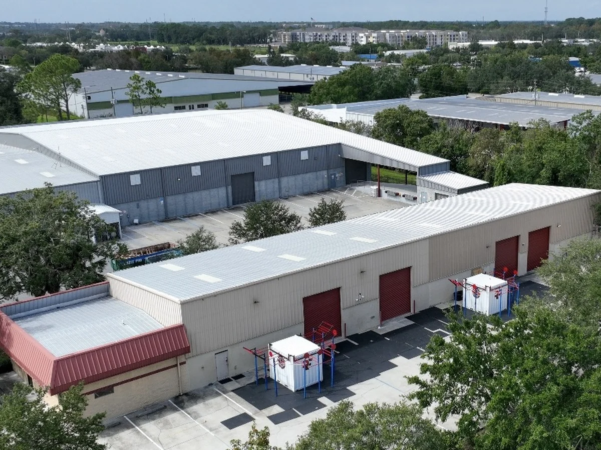 Wide aerial view of the CrossFit eXalted commercial building in Sanford, Florida, captured for the existing-conditions roof inspection project